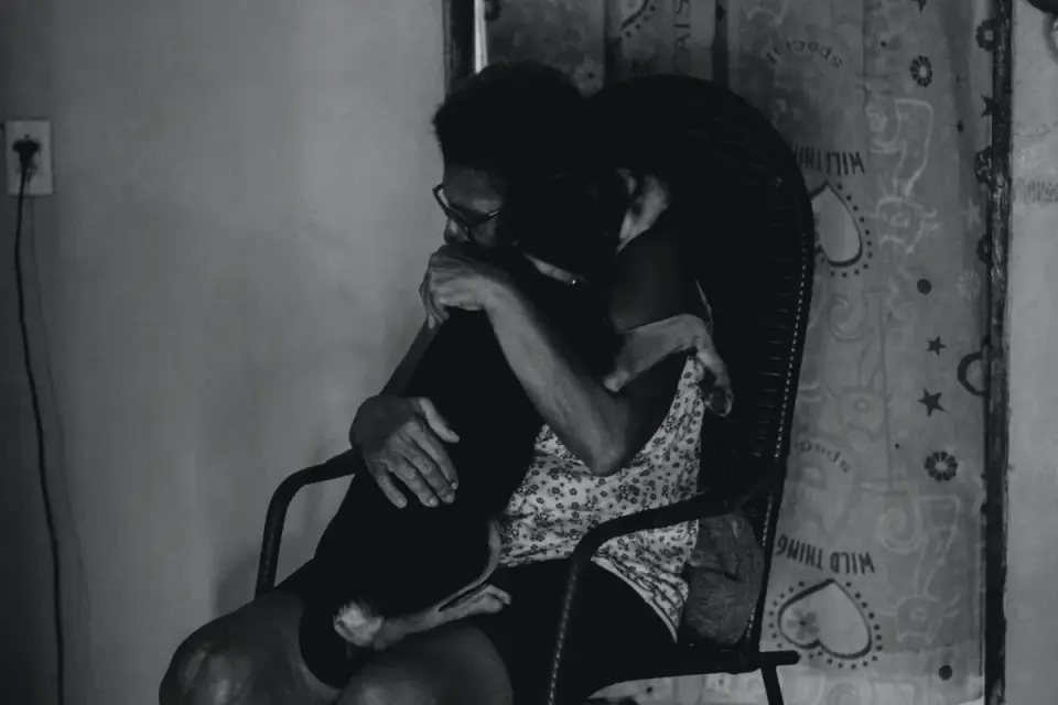 Dog being hugged by owner