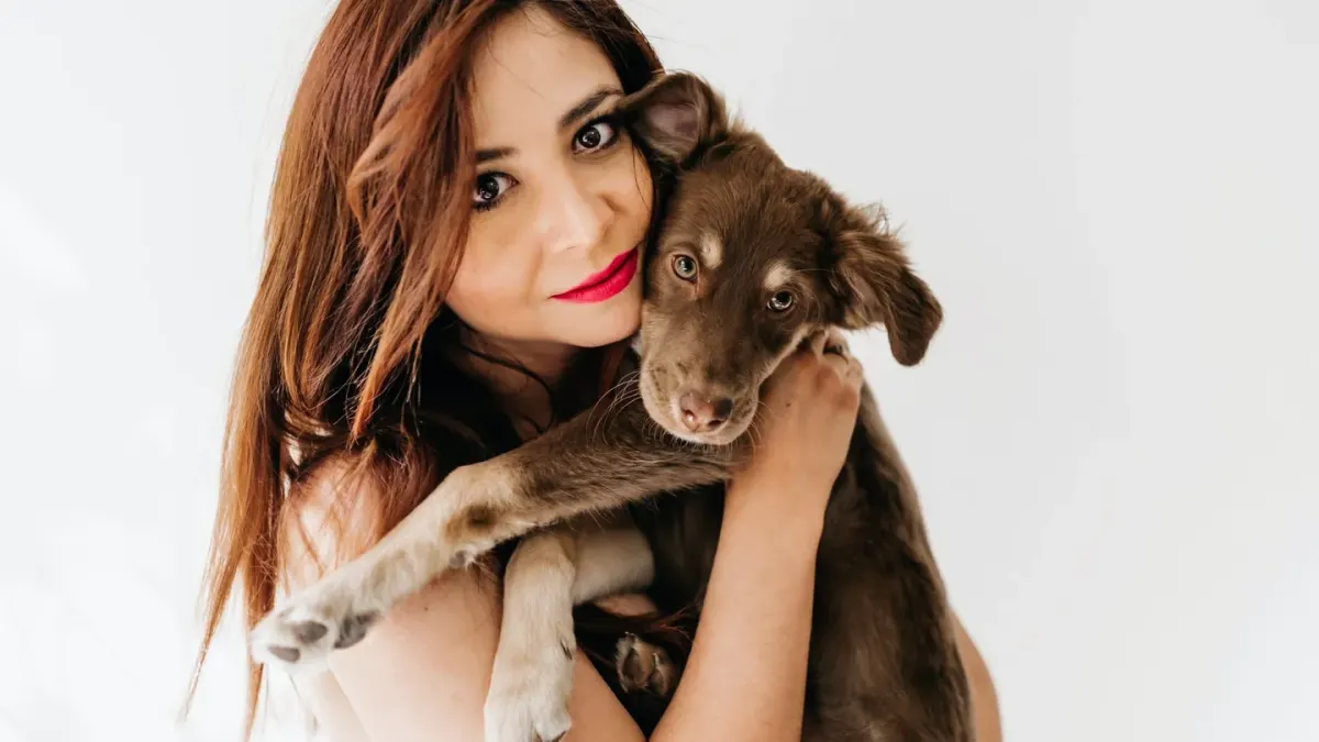 Dog being hugged by owner