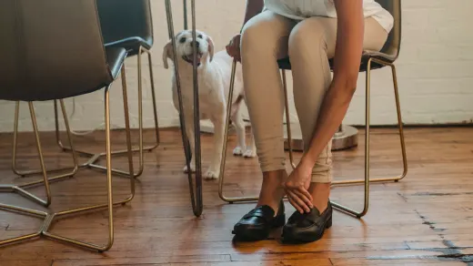 Owner and dog on floor together