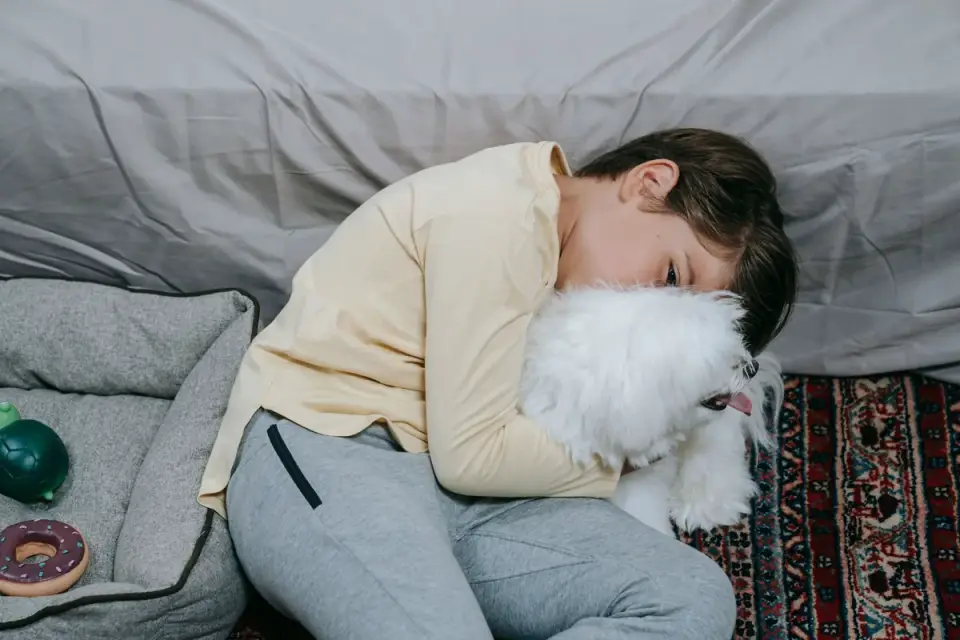 Owner and dog on floor together