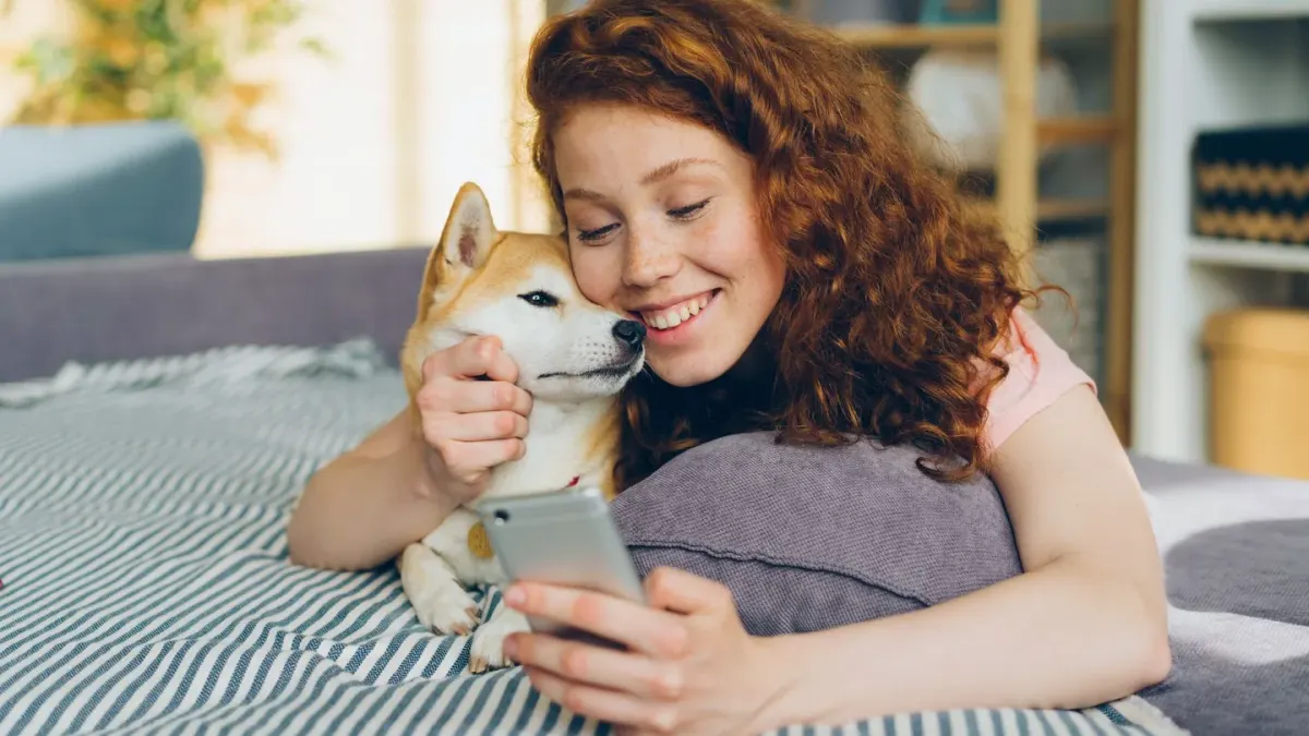 Owner and dog on floor together