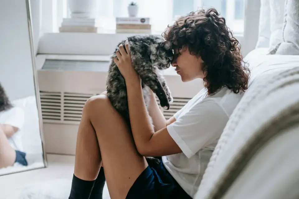 Owner and dog on floor together