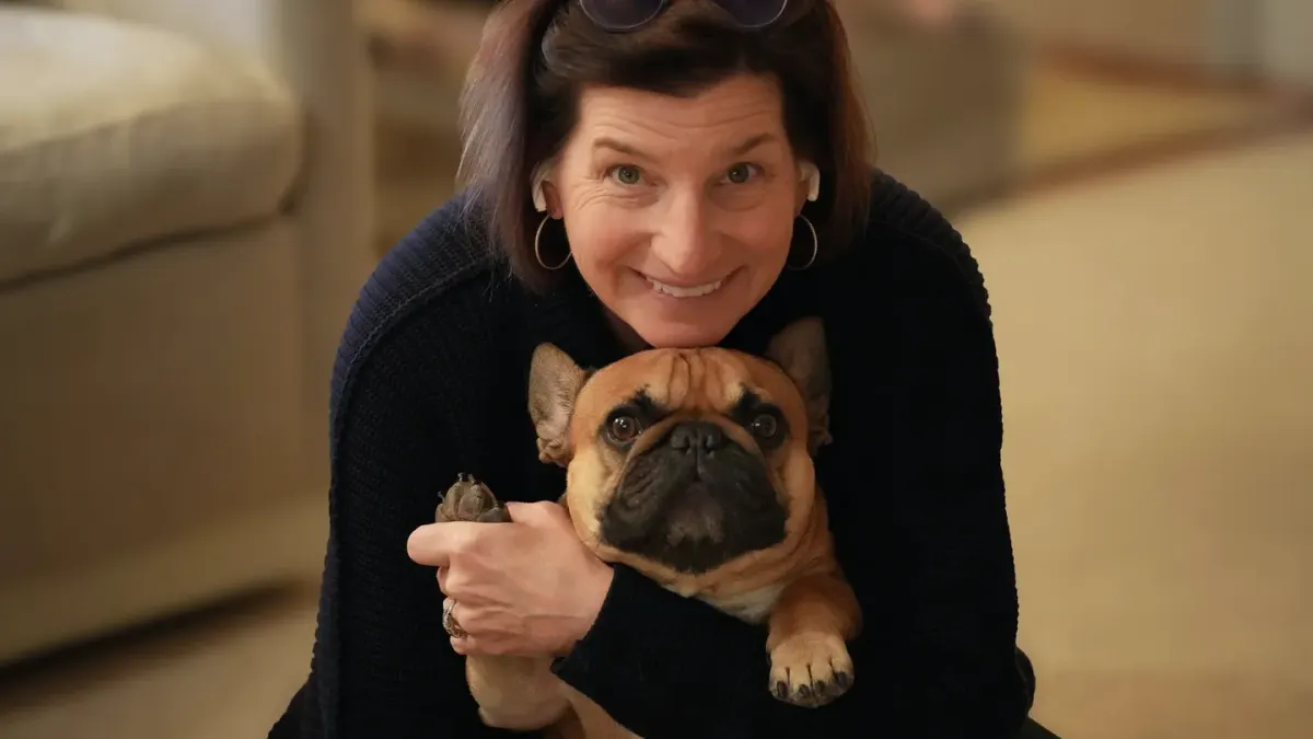 Owner and dog on floor together