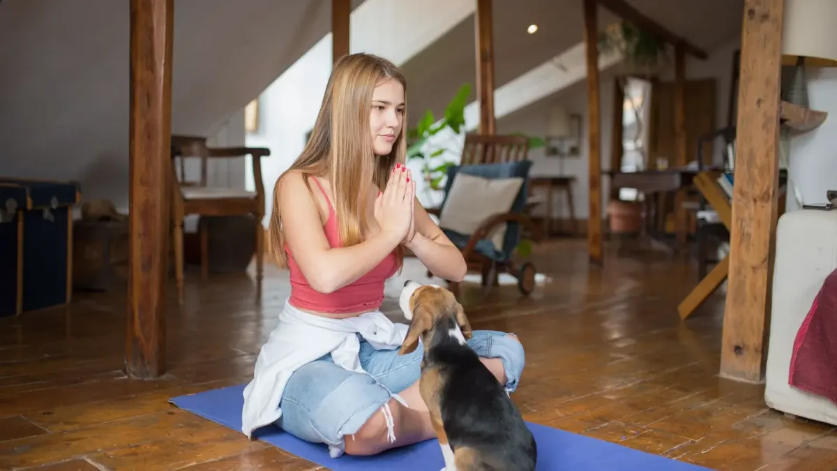 Owner and dog on floor together
