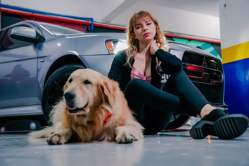 Owner and dog on floor together