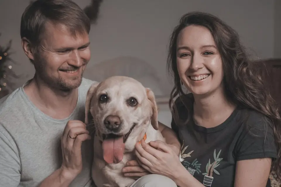 Owner and dog on floor together