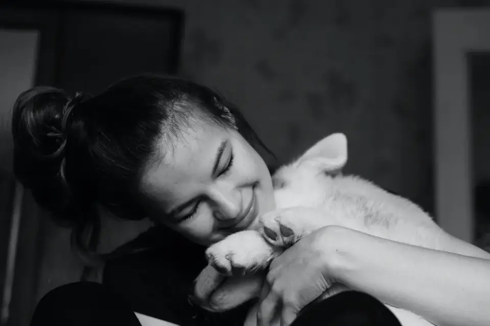 Owner and dog on floor together