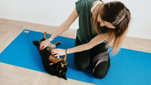 Owner and dog on floor together