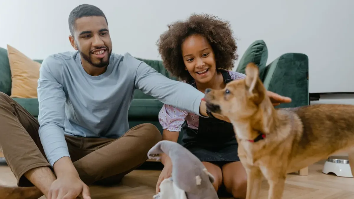 Owner and dog on floor together