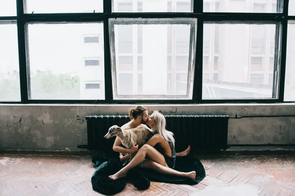 Owner and dog on floor together