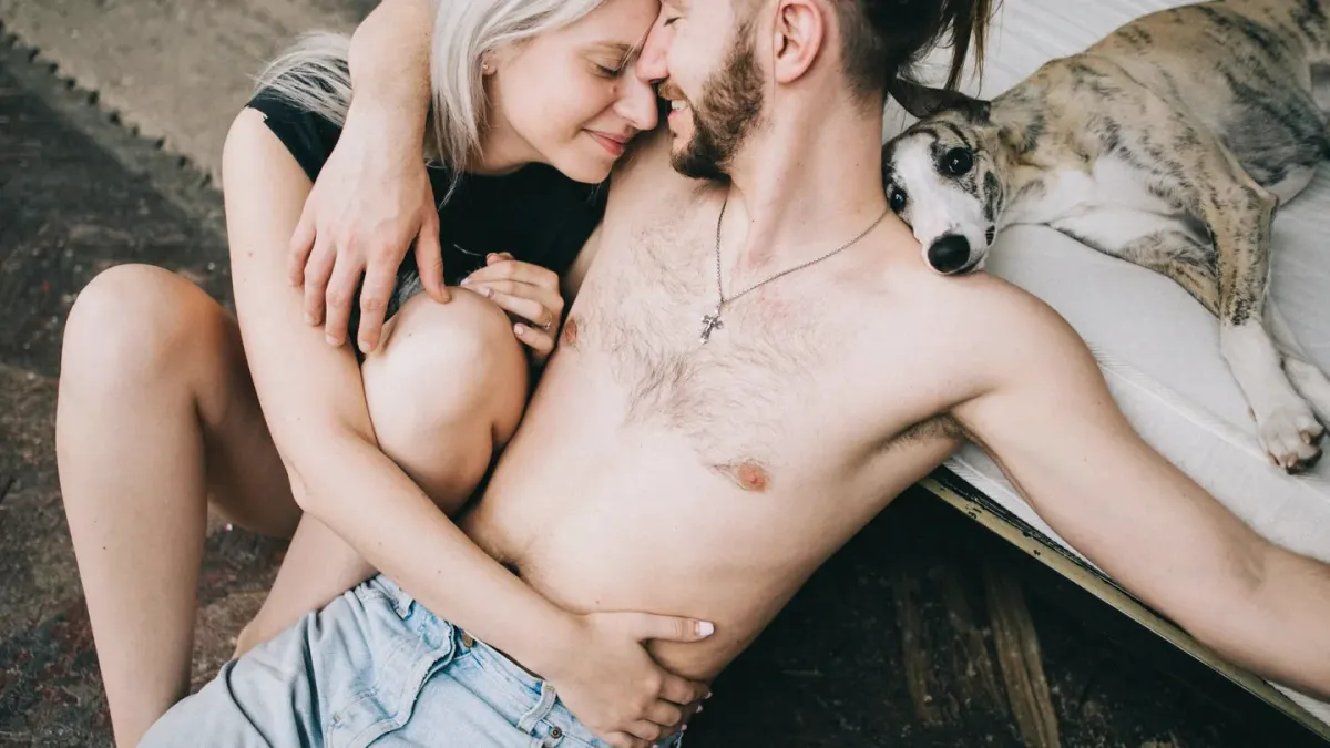 Owner and dog on floor together