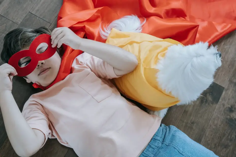 Owner and dog on floor together